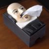 William Shakespeare tissue box holder with a tissue coming out of his nose.