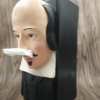 Quirky Shakespeare head tissue dispenser with paper coming out of his nostrils.