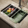 Foldable and adjustable vegetable washing basket and dish rack for efficient kitchen organization.