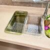 Space-saving kitchen drain basket with adjustable size for sink use.