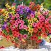Realistic faux flowers in a beige ribbed planter for home or patio decor