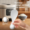 Cute and functional rice spoon standing upright on its rounded base