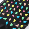 Folded black foot massage mat with colorful acupressure stones and reflex zone chart