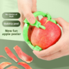 Hand using peeler on an apple