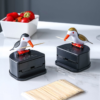 Cute bird toothpick holder dispensing a toothpick