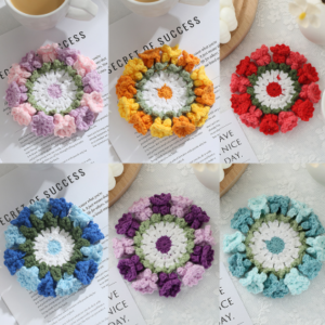 Handmade colorful crochet flower coasters arranged on table with tea and books – vintage yarn drink mats